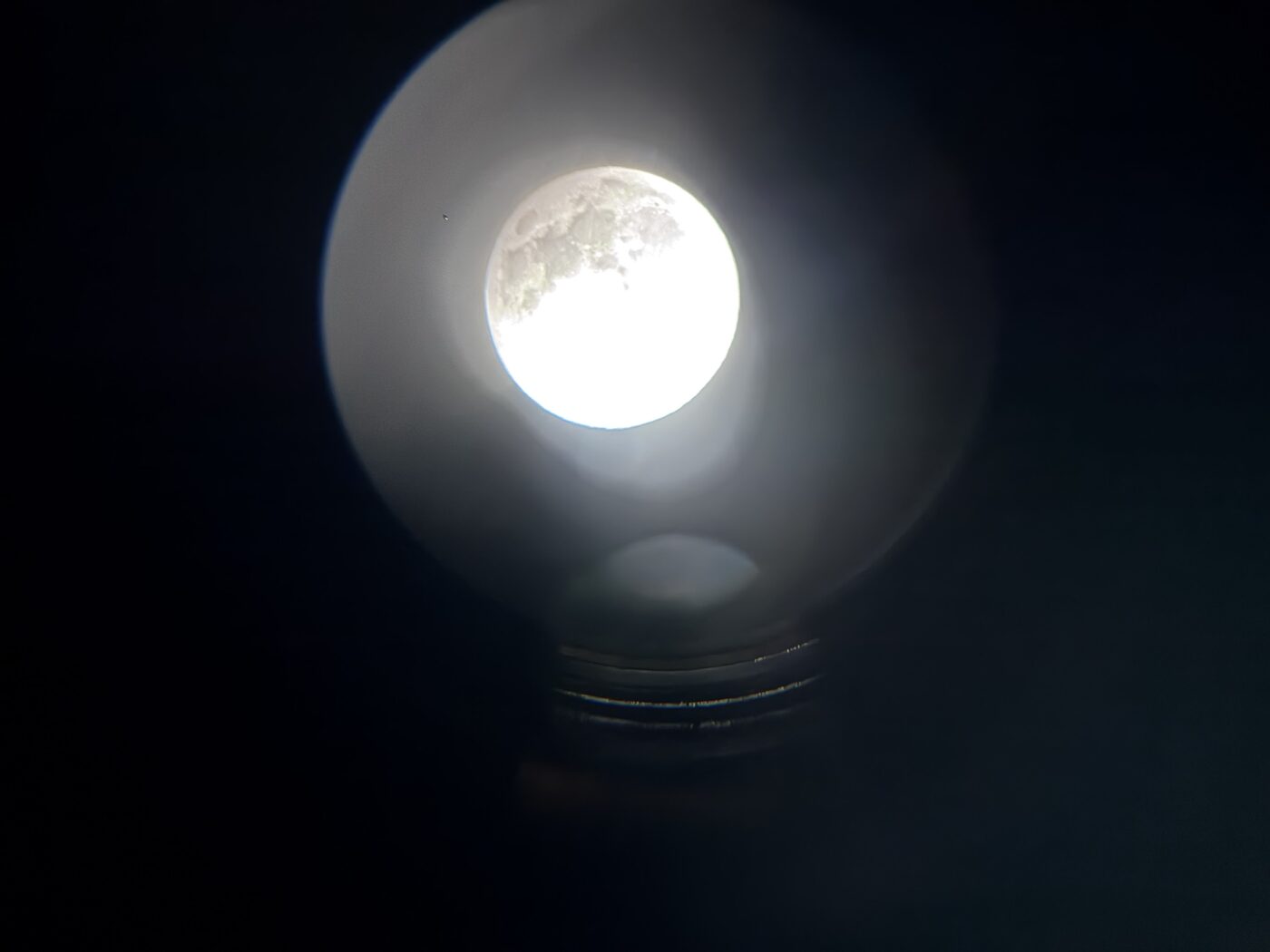 The full Moon centered in the eyepiece, held there by a mount 5° off the pole