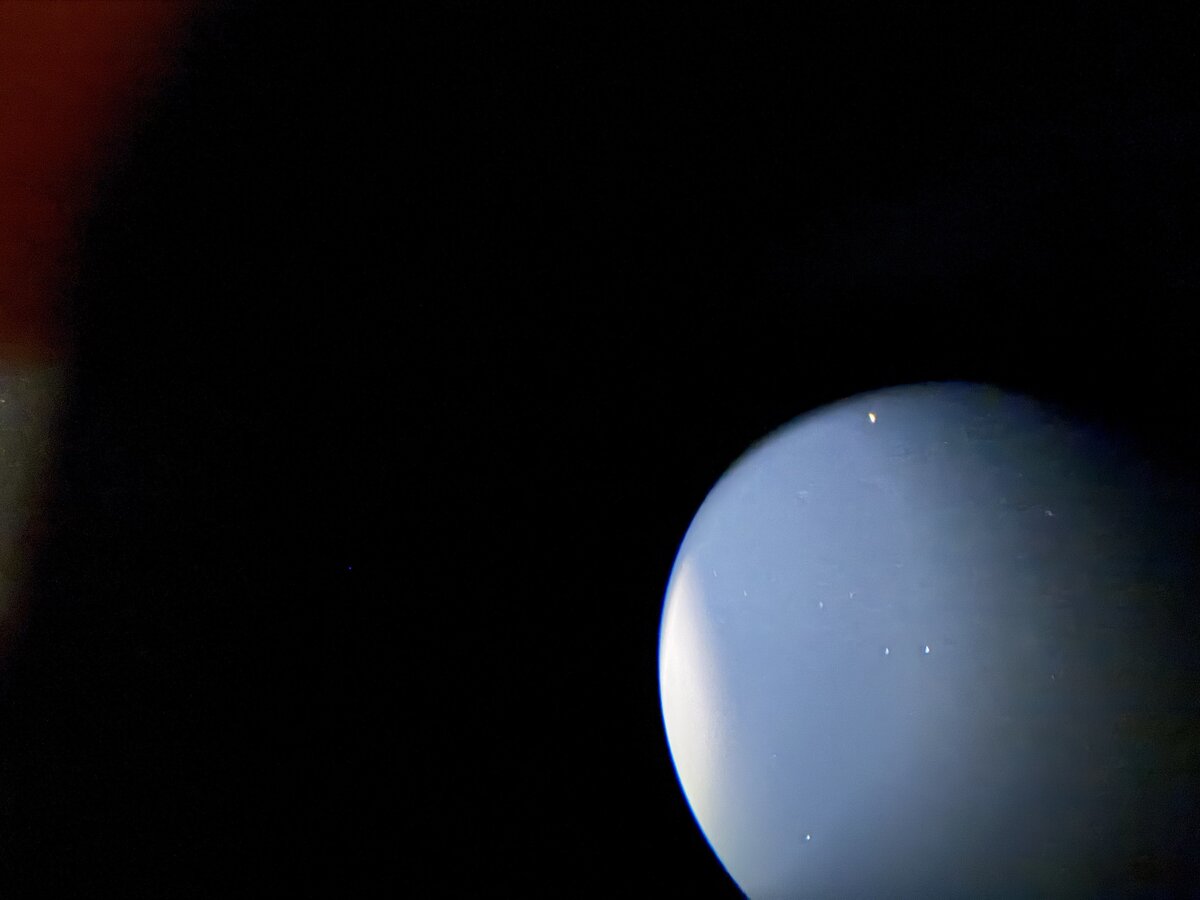 Plate thirteen: the Moon's glare, the edge of the eyepiece, and a few stars